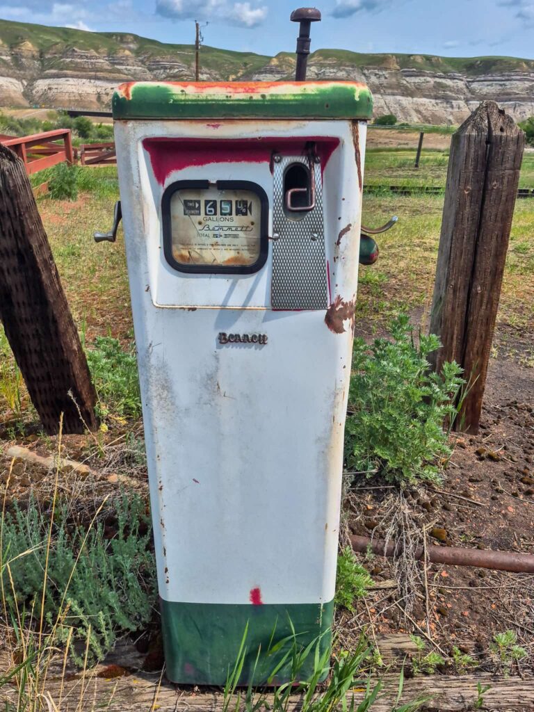 An old white and green gas pump in the Machine Yard at the Atlas Coal Mine