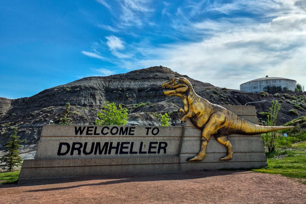 The "Welcome to Drumheller" sign with a golden tyrannosaurus rex.