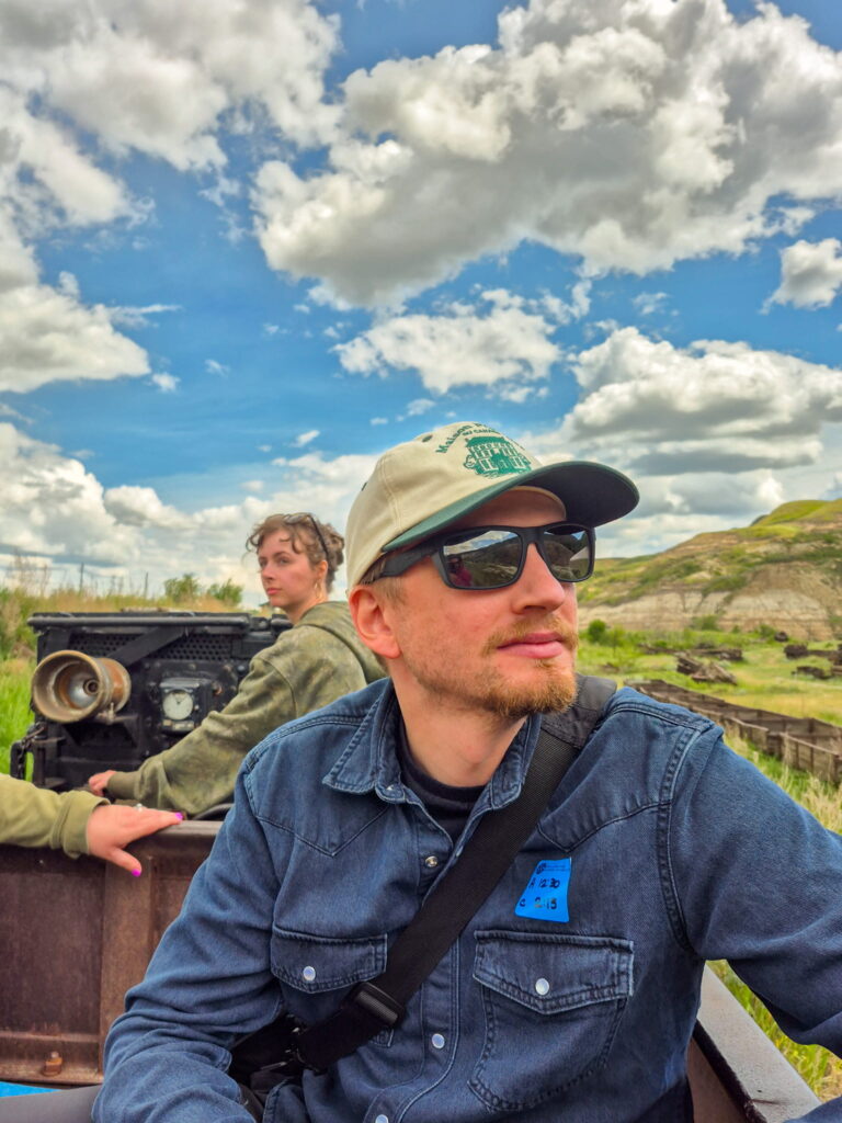 Justin sitting in the mine train in front of our guide.