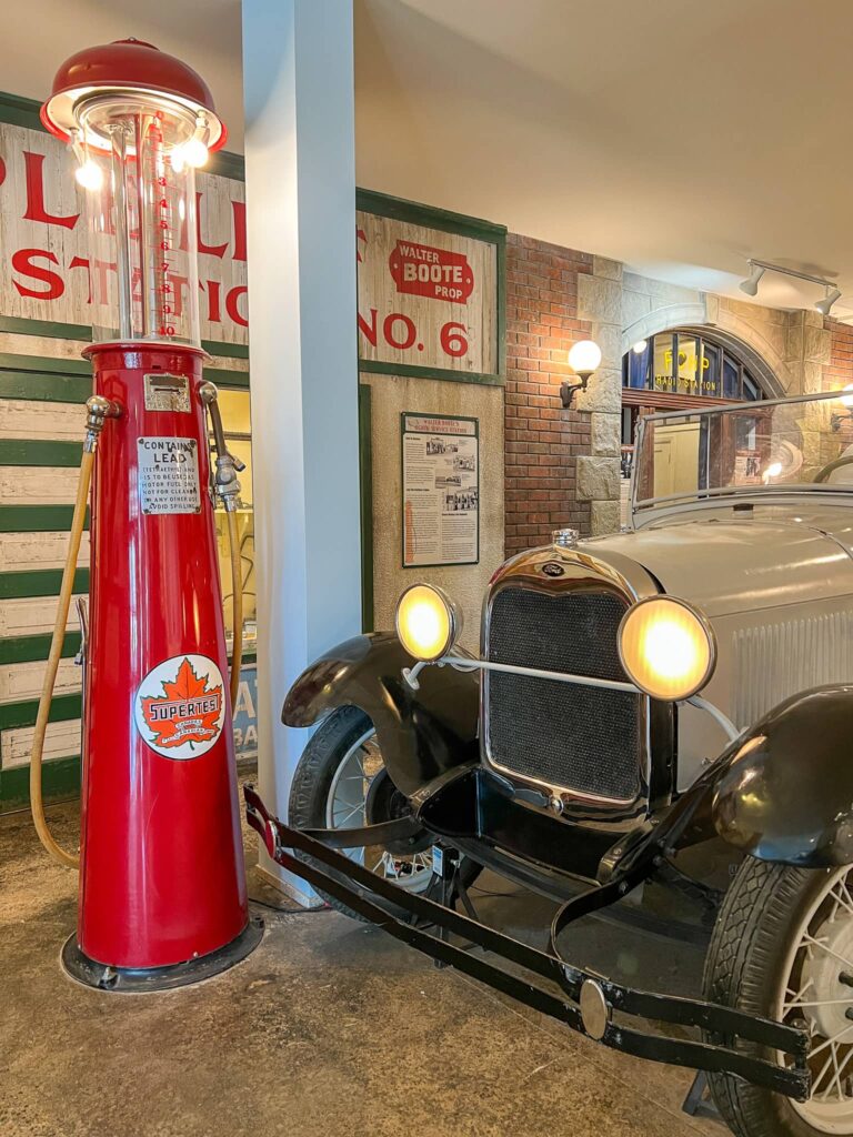 An old ford car and a gas pump in the Confluence