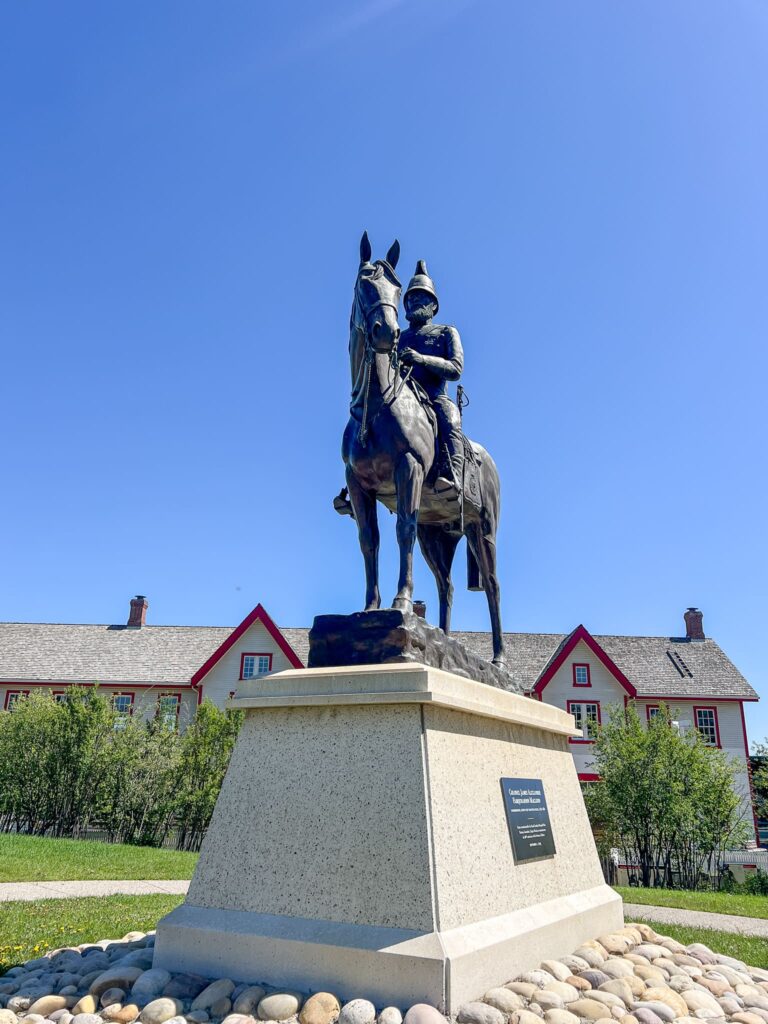 A bronze statue of Colonel James Macleod on a horse.