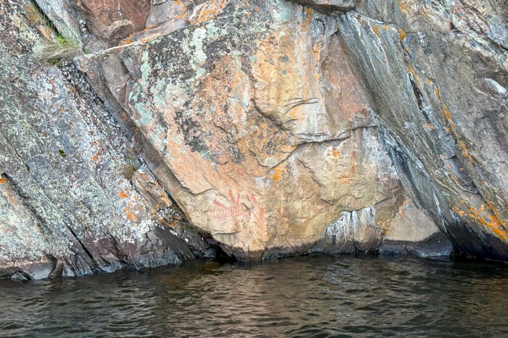 Various pictographs on Mazinaw Rock including one of the rock itself and a turtle