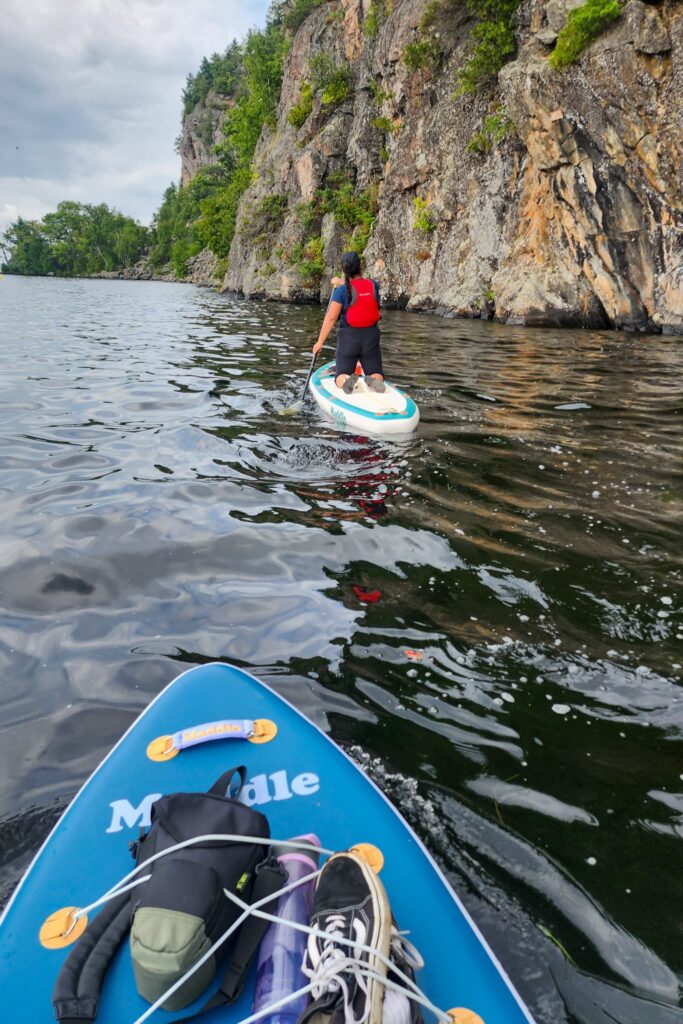 Paddling on Mazinaw Lake on two paddle boards