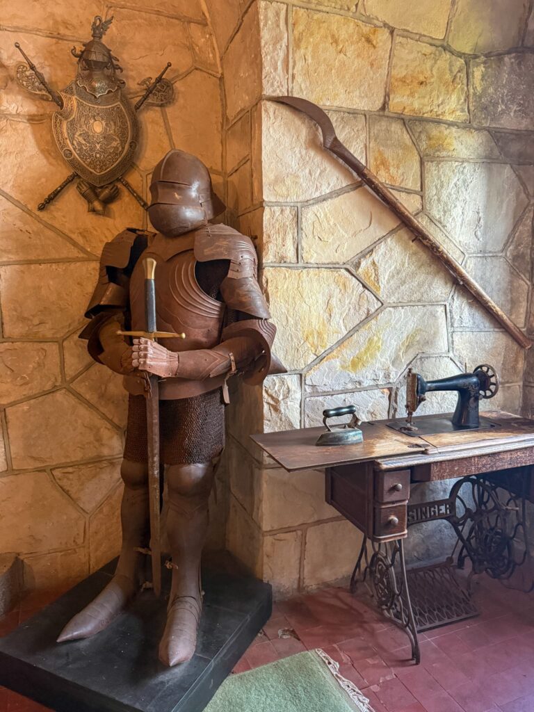 A suit of armour and Singer sewing machine in Singer Castle.