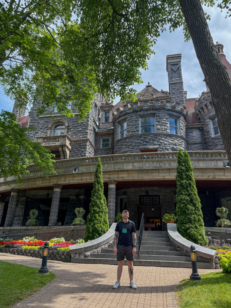Justin standing in front of the main entryway to Boldt Castle.
