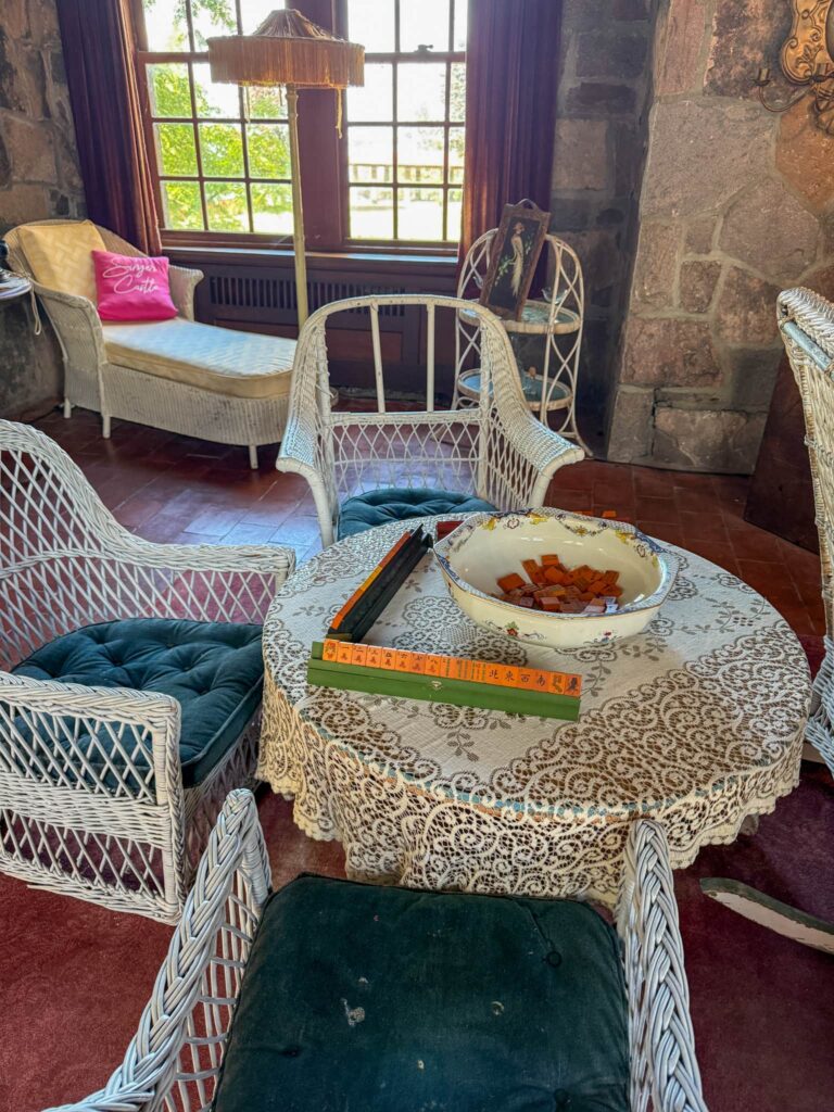 A staged mahjong game inside Singer Castle.