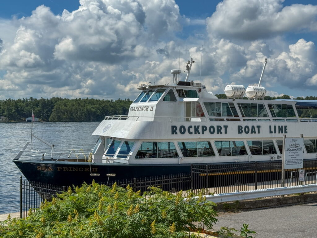 The Sea Prince II, it is a two-level black and white boat. It says Rockport Boat Line on the side and offers the 1000 Islands Cruise.